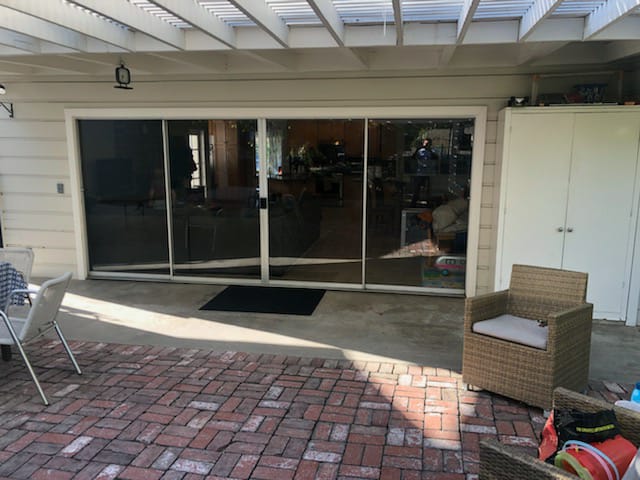 Before. Two Wood doors. Single pane glass, splitting rotted wood on bottom. Sierra Madre. Patio door is single pane clear glass. (5)