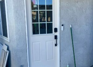 Half light fiberglass door with internal flat grids... bronze hardware